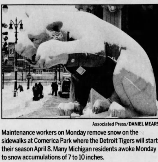 Maintenance workers remove snow